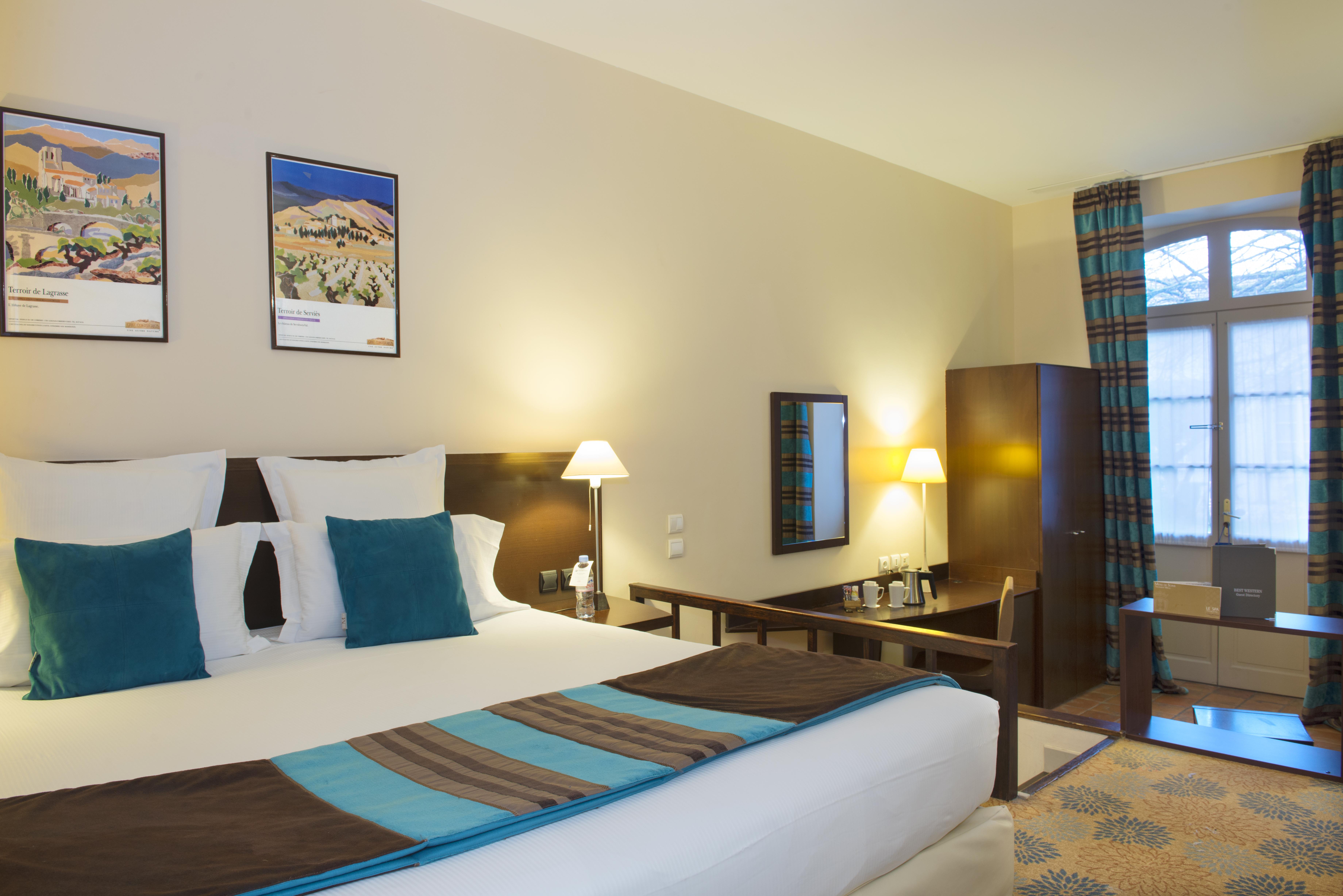เบสต์ เวสเทิร์น เลอ ดงฌง เล ร็องปาร์ต Hotel การ์กาซอน ภายนอก รูปภาพ